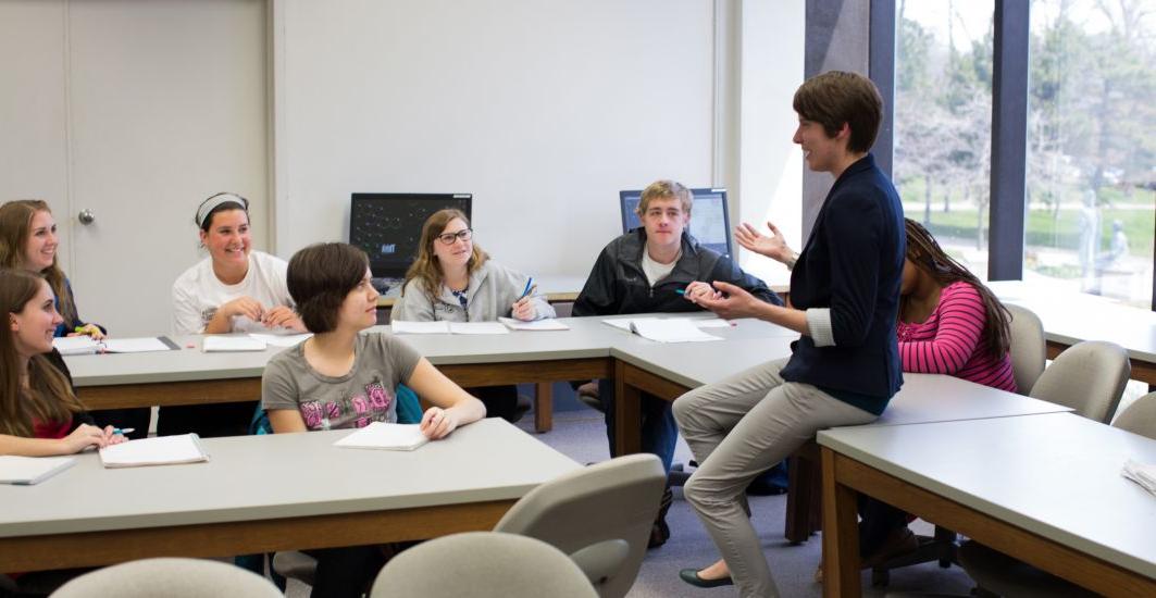 Prof. Haley Yaple helps students pursuing a mathematics major in a math class.